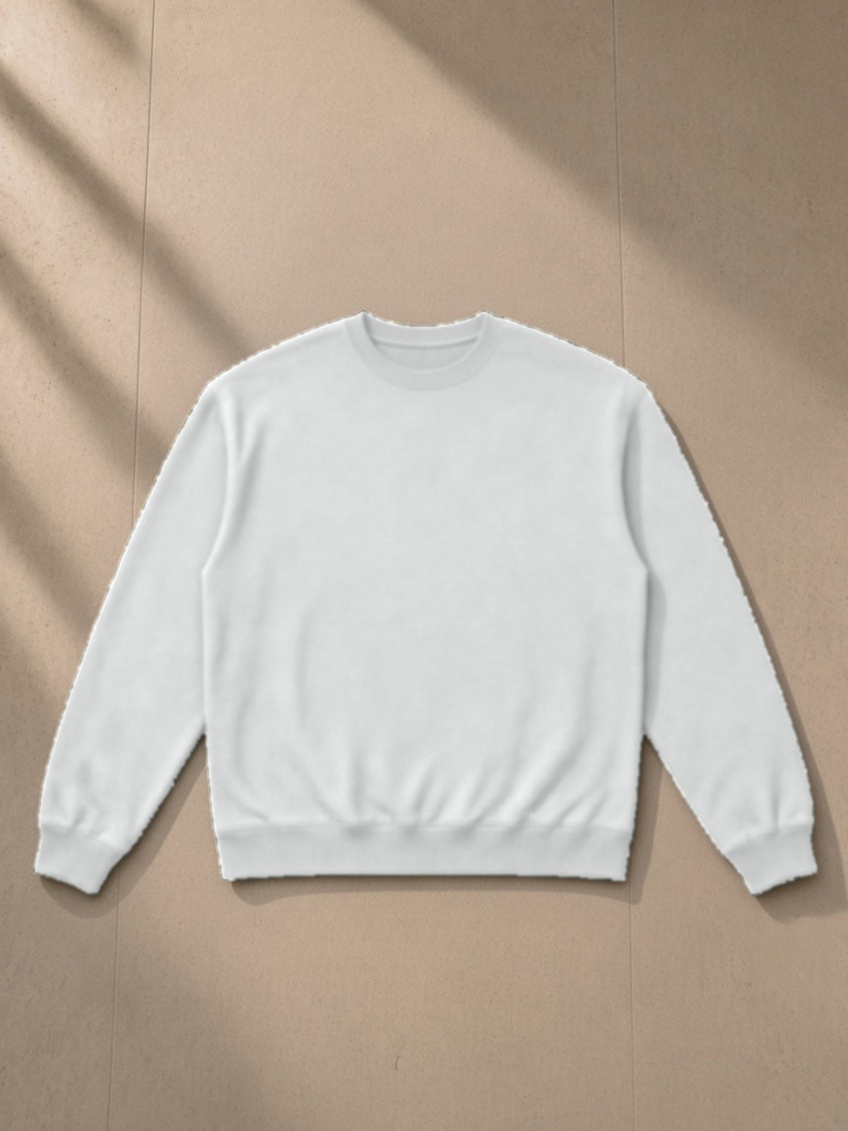 Heavyweight Crewneck Sweatshirt in Light Gray, laid flat on pale limestone, front view