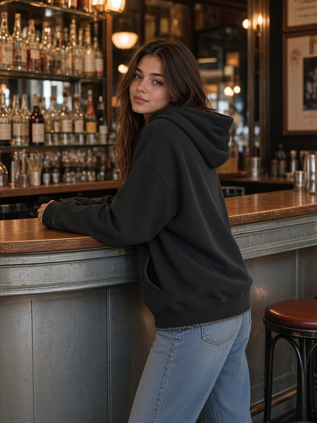 Woman in the Vintage Wash Raw Edge Boxy Hoodie in Black, model front