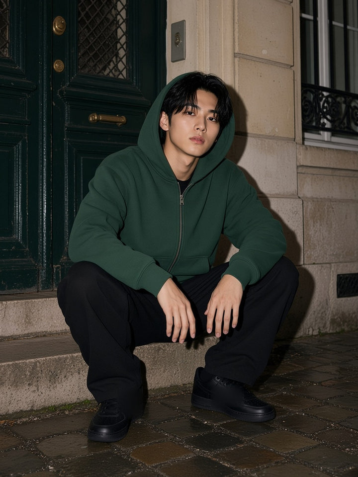 Man in the Essential Fleece Zip-Through Hoodie in Eden Green, model front