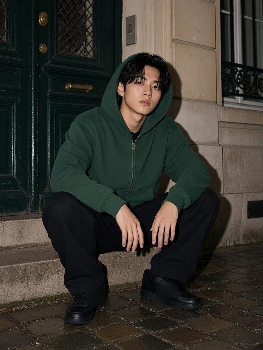 Man in the Essential Fleece Zip-Through Hoodie in Eden Green, model front