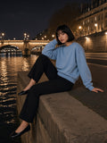 Woman in the Boxy Vintage Washed Sweatshirt in Light Blue, model front