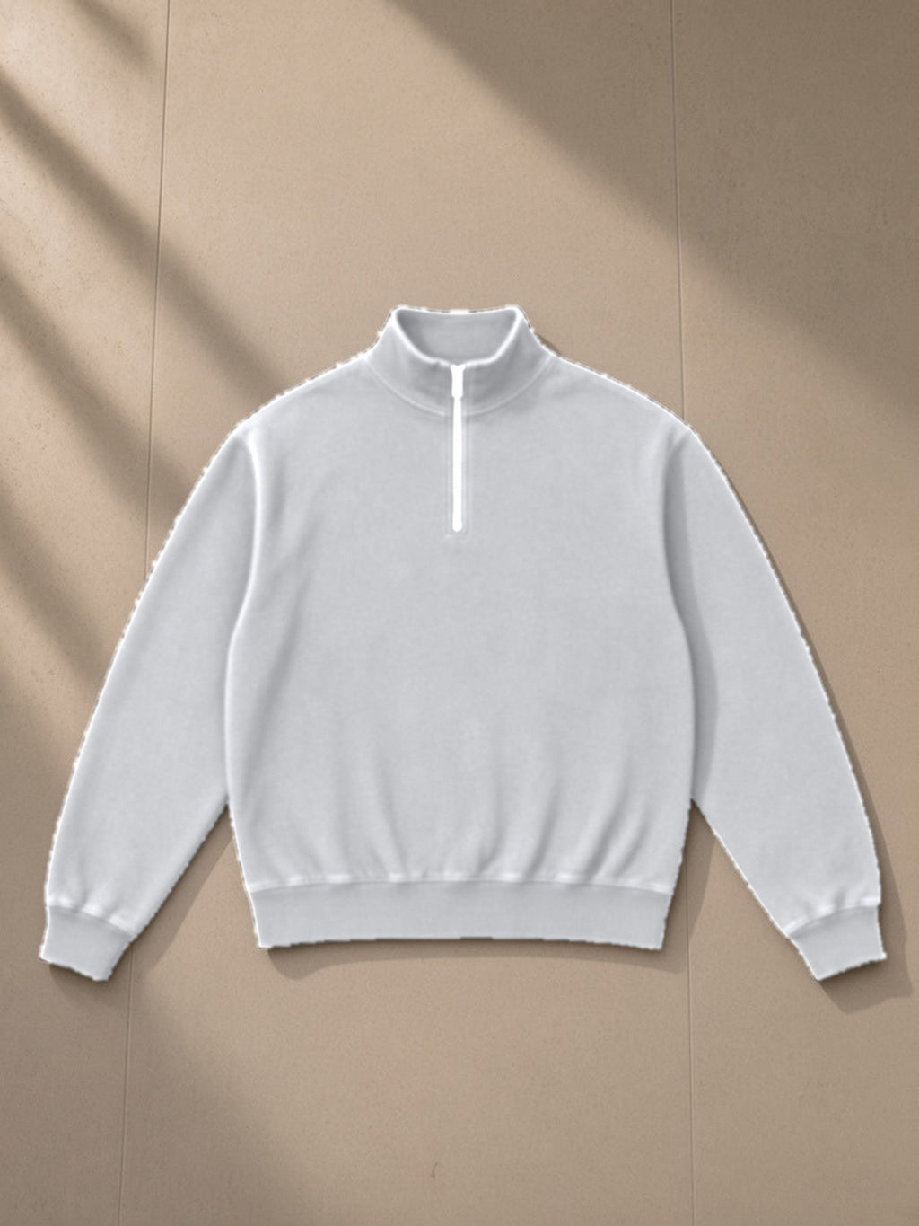 Unisex vintage wash fleece quarter zip sweatshirt in Flower Gray, laid flat on pale limestone, front view