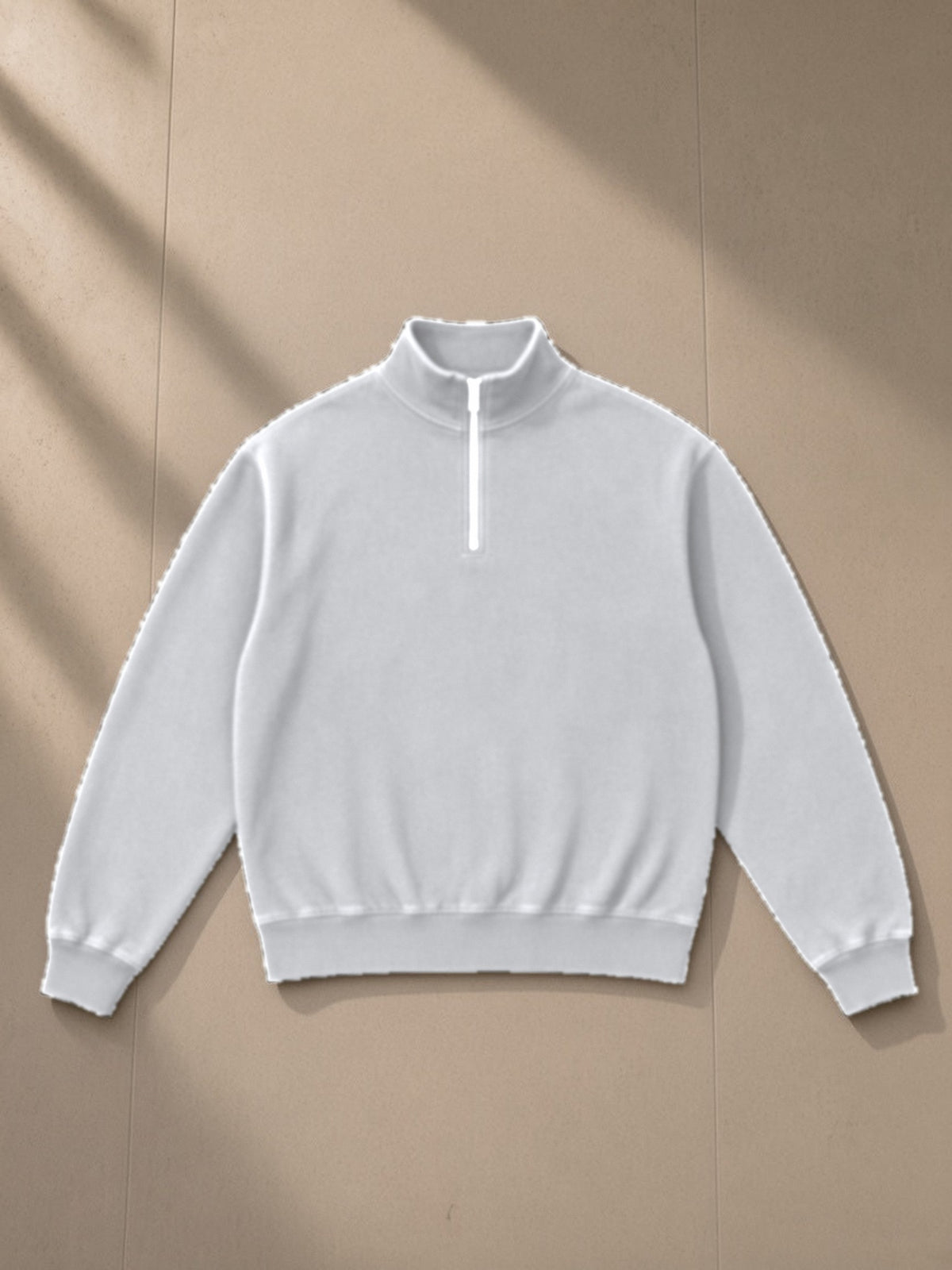 Unisex vintage wash fleece quarter zip sweatshirt in Flower Gray, laid flat on pale limestone, front view