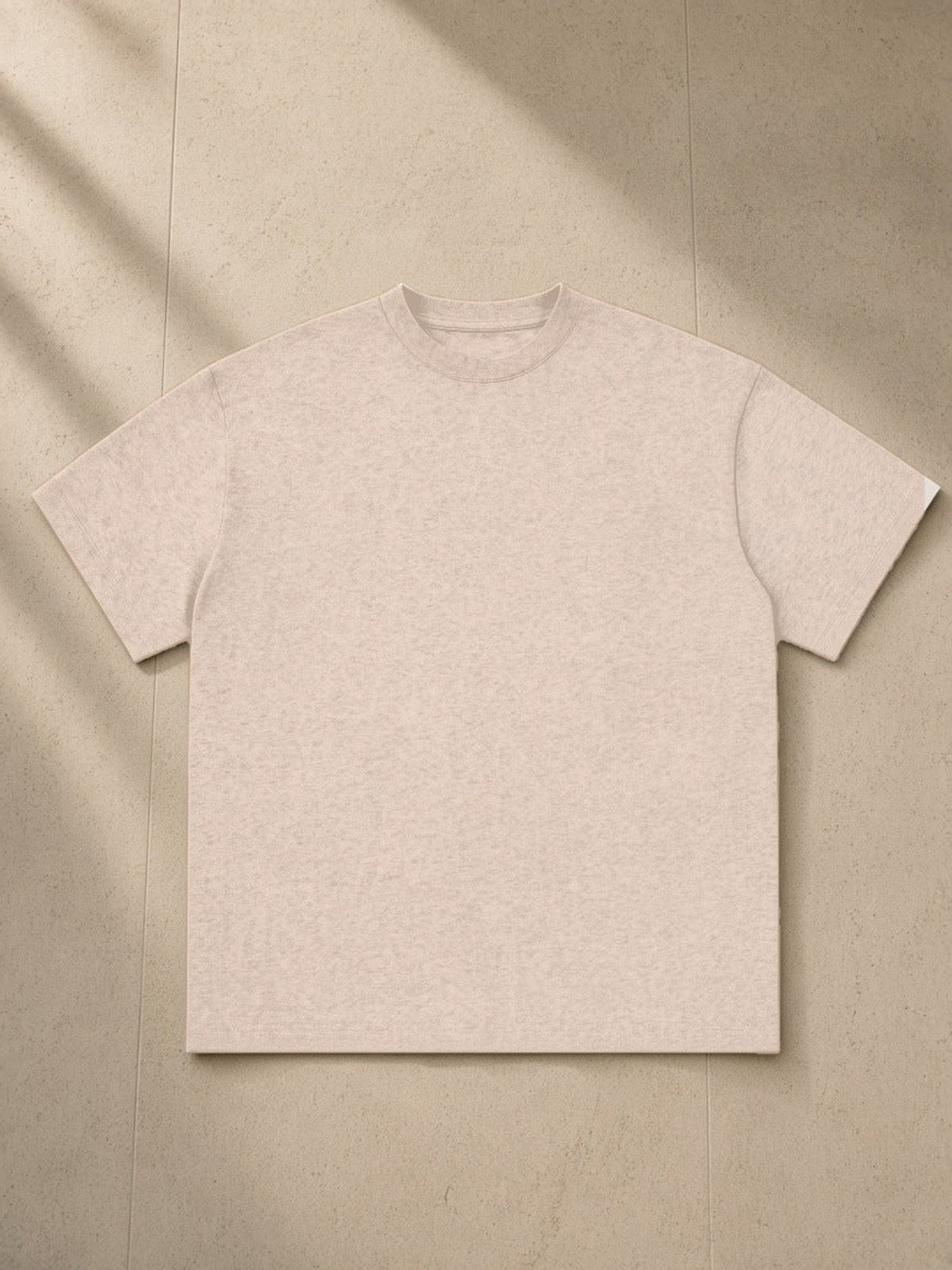 Essential Cotton T-Shirt, 260 gsm, Drop Shoulder in Khaki Flower Gray, laid flat on pale limestone, front view