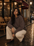 Woman in Marcel Afters Vintage Wash Waffle Boxy Hoodie in Brown, model front