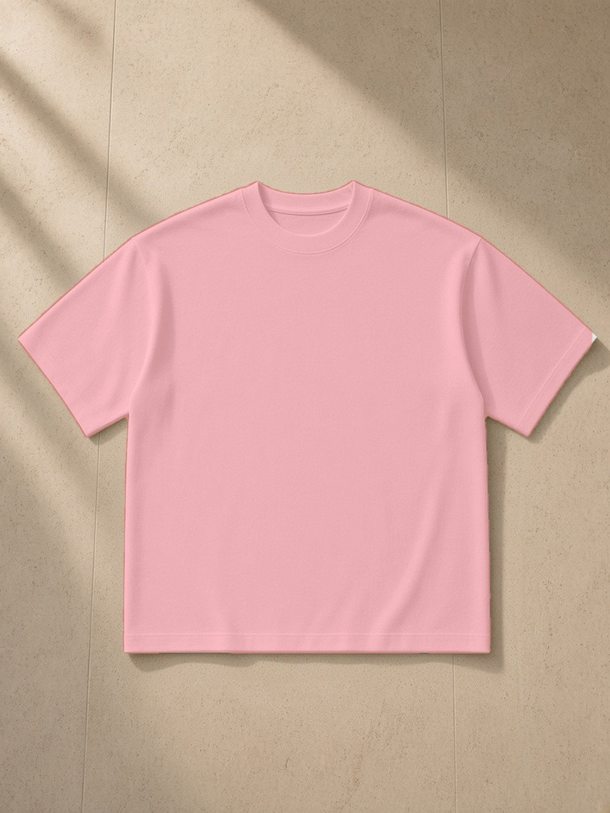 Boxy Mesh Crewneck T-Shirt in Pink, laid flat on pale limestone, front view