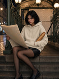 Woman in Marcel Afters Essential Heavyweight Hoodie in Apricot, model front