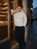 Man in Marcel Afters Essential Heavyweight Hoodie in Oat Gray, model front