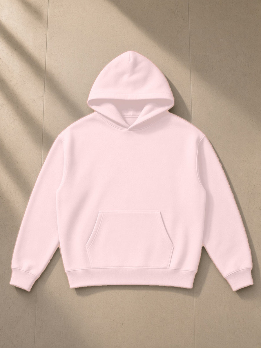 Essential Heavyweight Hoodie in Pink, laid flat on pale limestone, front view