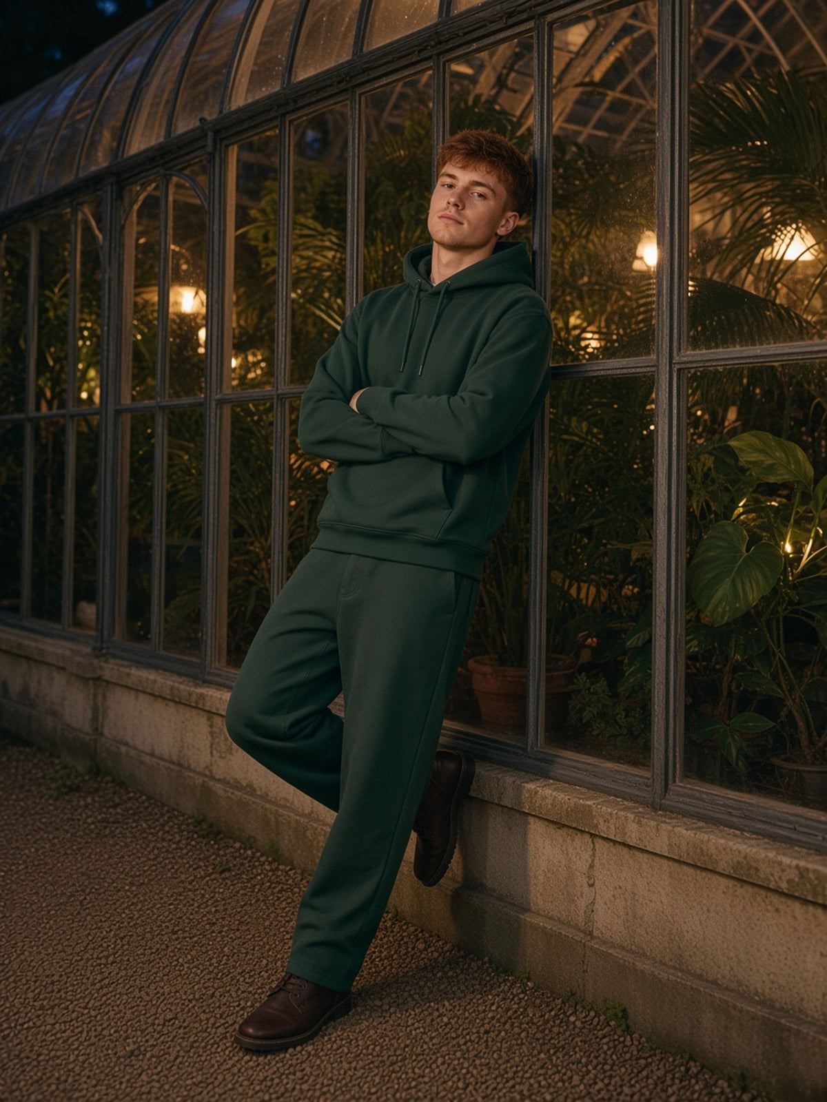 Man in Marcel Afters Essential Heavyweight Hoodie in Blackish Green, model front
