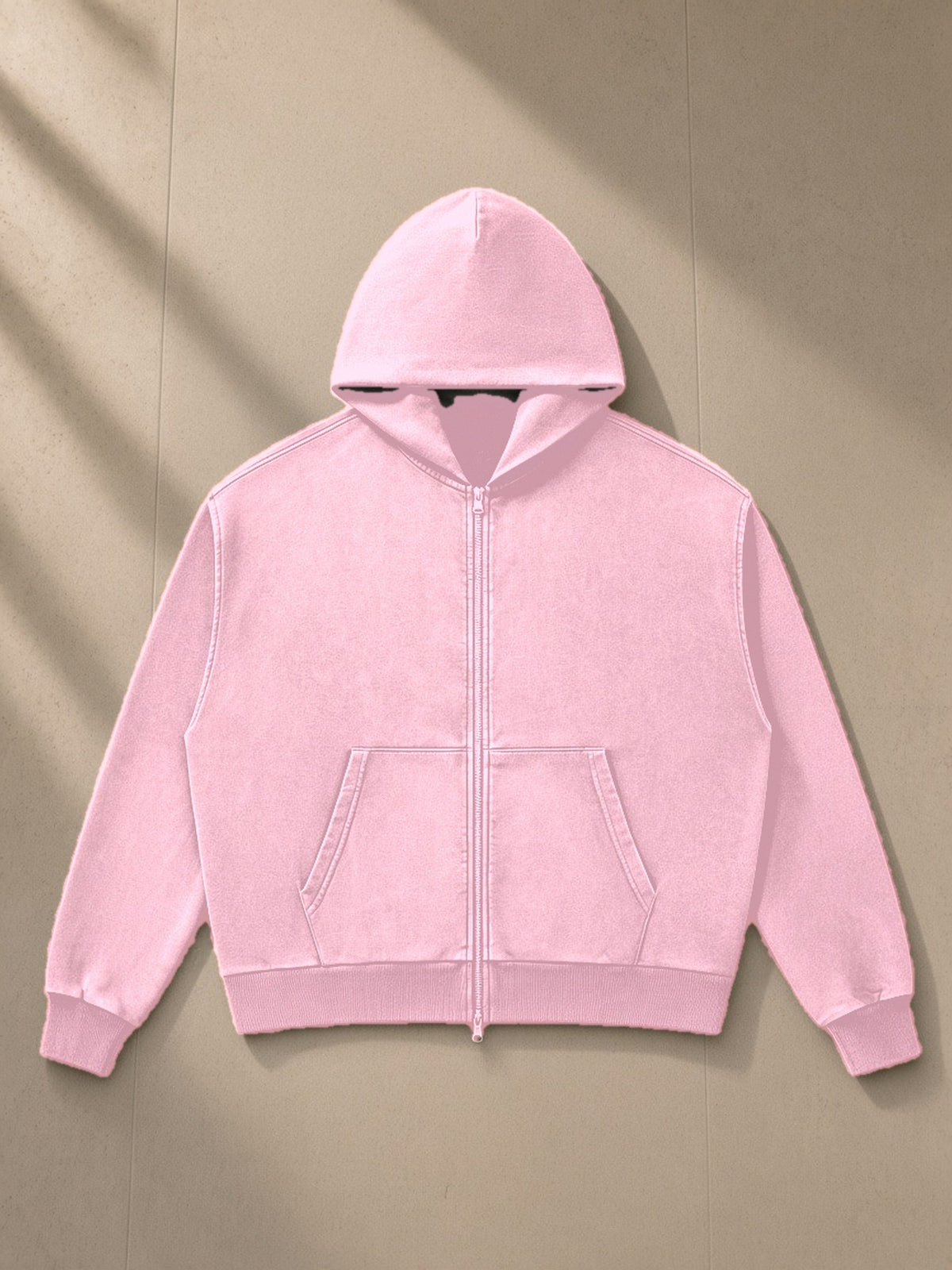Mineral Wash Boxy Full Zip Hoodie in Pink, laid flat on pale limestone, front view