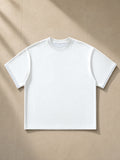 Boxy Plaid-Lined Double-Face T-Shirt in White, laid flat on pale limestone, front view