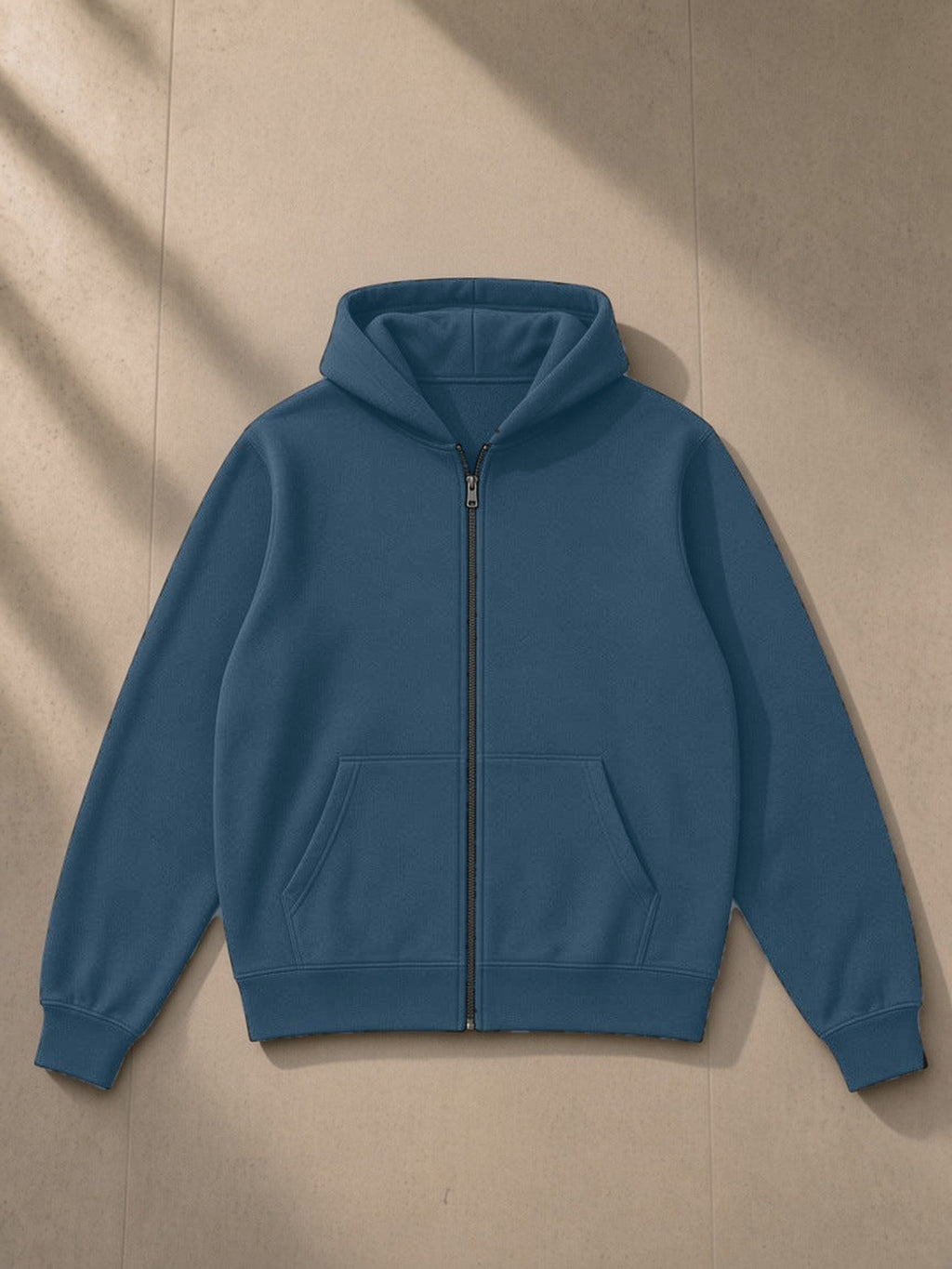 Fleece Full Zip Hoodie in Haze Blue, laid flat on pale limestone, front view