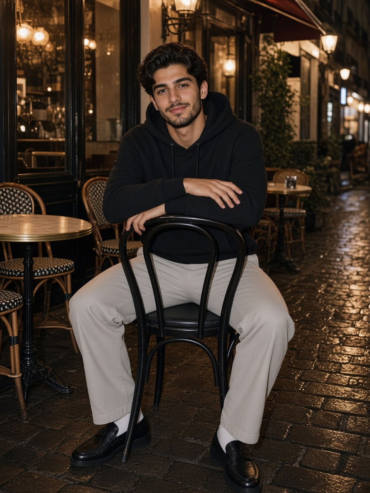 Man in the Relaxed Fit Hoodie in Black, model front