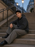 Man in the Vintage Wash Boxy Hoodie in Black, model front