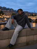 Man in the Snow Wash Hand-Frayed Heavyweight Hoodie in Black, model front