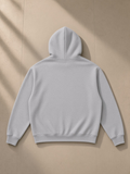 Unisex loose full zip hoodie in Flower Gray, laid flat on pale limestone, back view