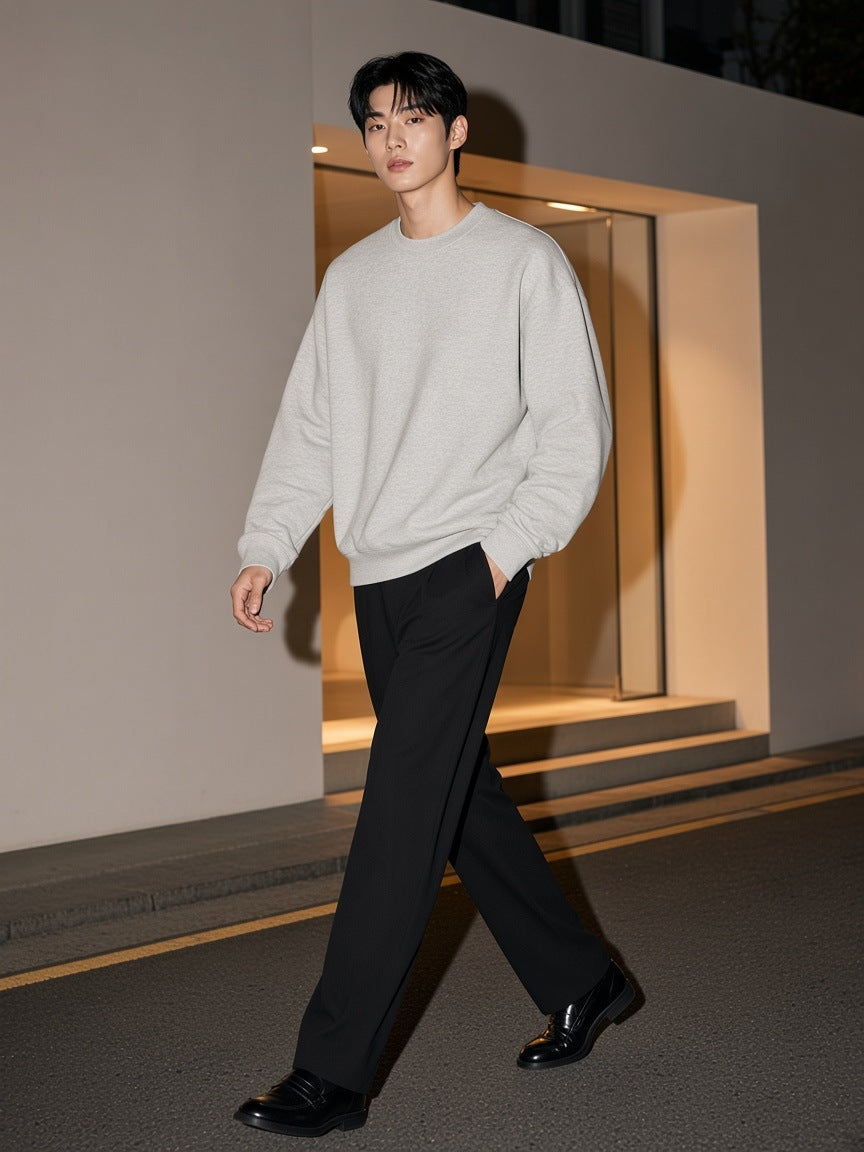 Man in the Boxy Fleece Crewneck Sweatshirt in Flower Gray walking past a gallery in Hannam-dong, Seoul at night