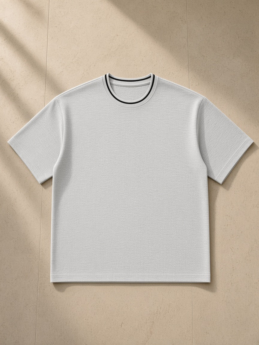 Boxy Ribbed T-Shirt in Heather Gray, laid flat on pale limestone