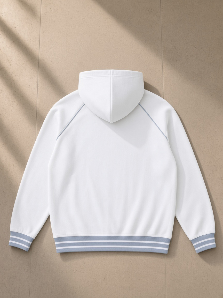 Women's Striped Trim Zip-Up Hoodie in White, laid flat on pale limestone, back view