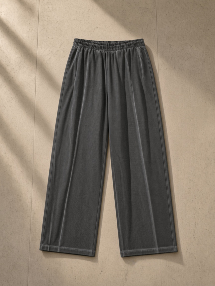 Vintage Wash Wide Leg Mesh Sweatpants in Dark Gray, laid flat on pale limestone, back.
