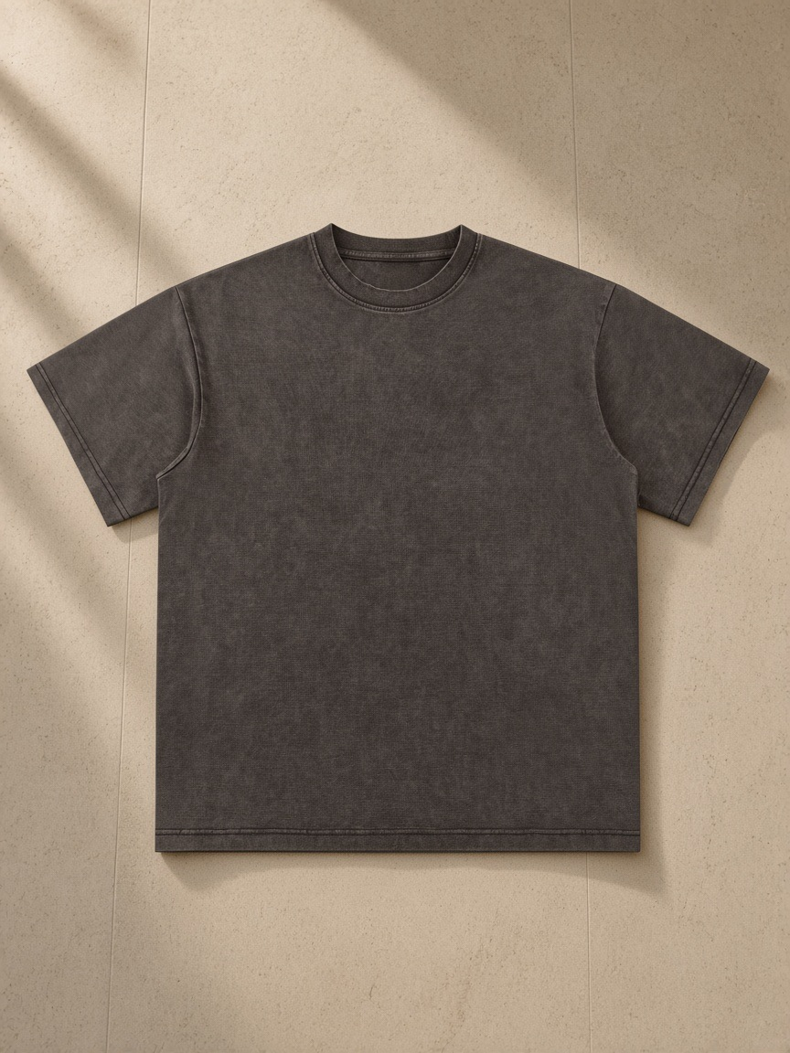 Unisex bamboo slub snow washed t-shirt in Coffee, laid flat on pale limestone