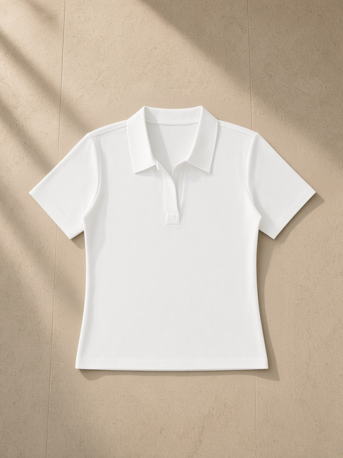 Bodycon Short Sleeve Polo Shirt in White, laid flat on pale limestone