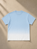 Sunfade Vintage Washed T-Shirt in Blue, laid flat on pale limestone, front.