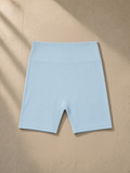 High-Waisted Blend Biker Shorts in Sky Blue, laid flat on pale limestone