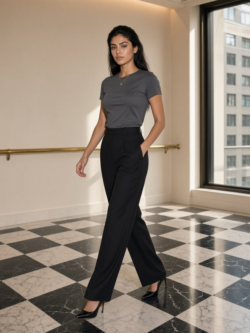 Woman in the Classic Crew Neck Cotton T-Shirt in Formal Gray in a marble hotel lobby on the Upper East Side, New York in the morning