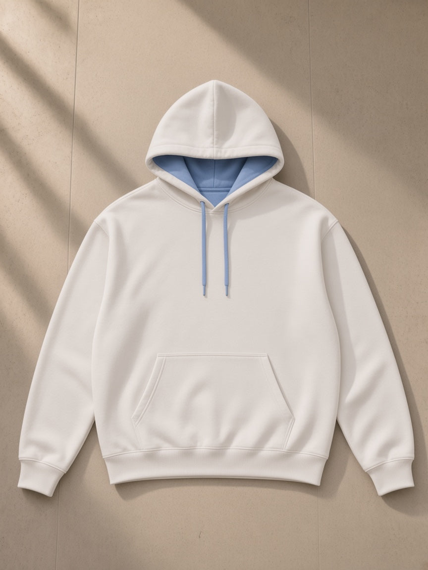 Contrast drawstring hoodie in White, laid flat on pale limestone, front view