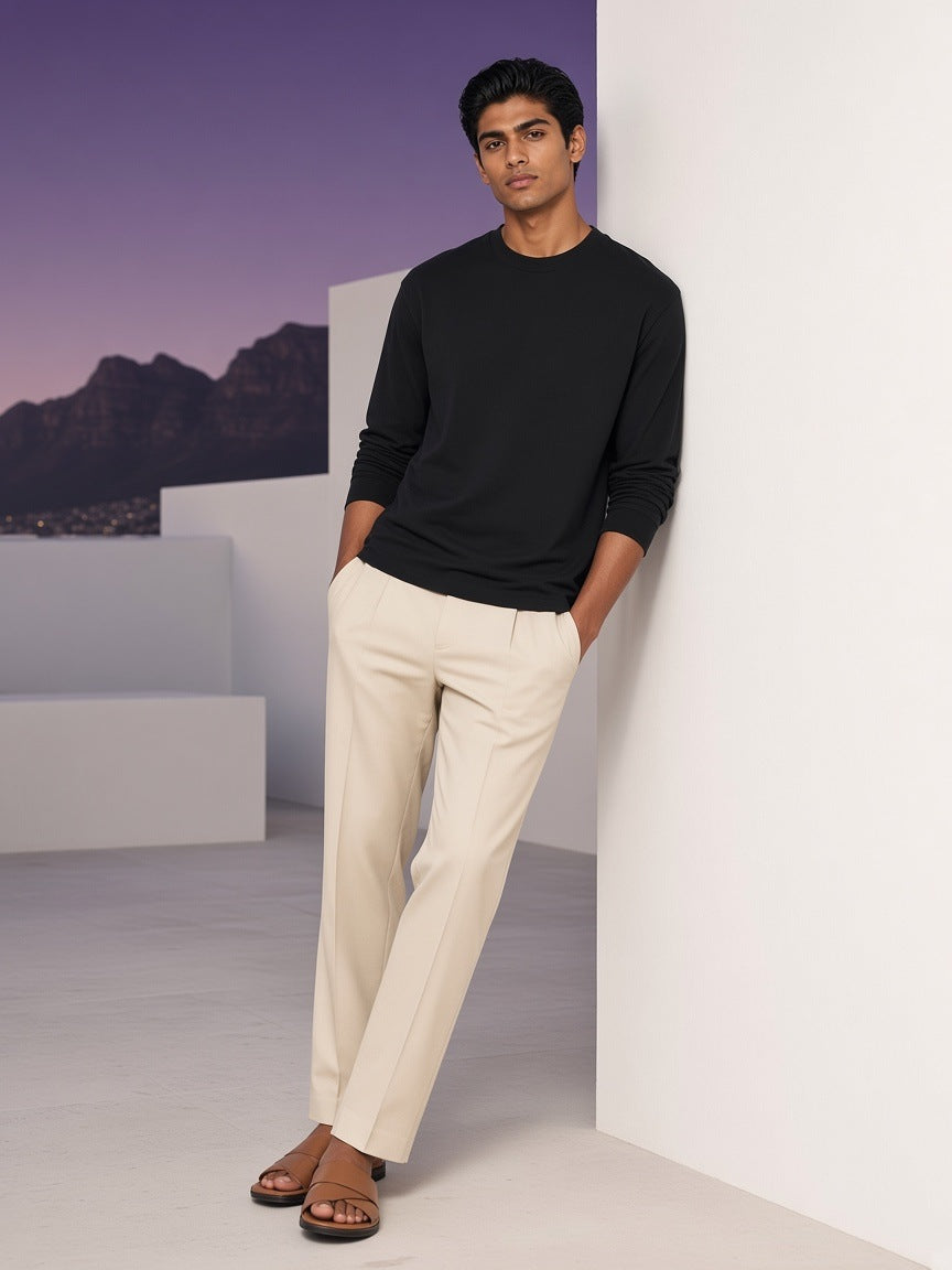 Man in the Crew Neck Drop Shoulder Long Sleeve Shirt in Black on a villa terrace in Cape Town