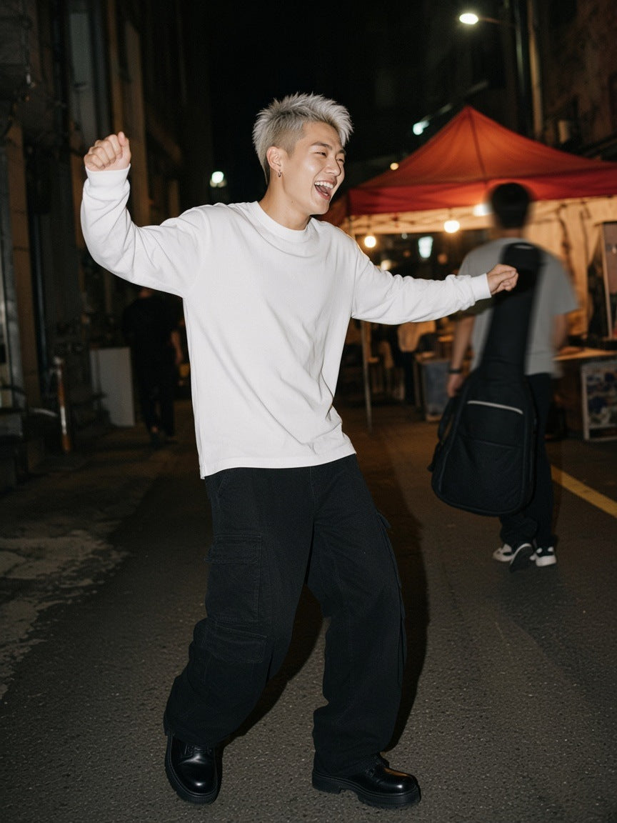 Man in the Crew Neck Drop Shoulder Long Sleeve Shirt in Basic White, dancing in a Seoul alley after a gig at 1am