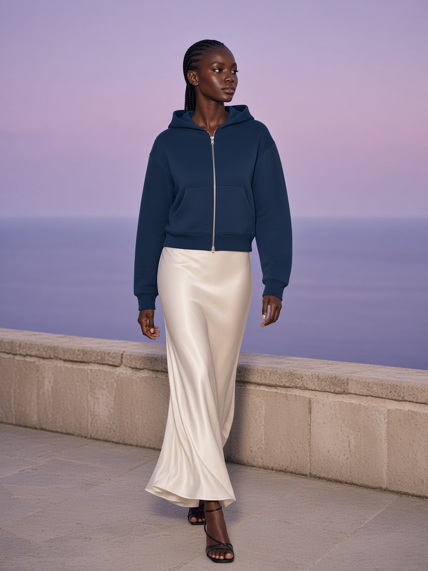 Woman in the Cropped Zip-Through Hoodie in Navy Blue on a limestone sea terrace in Capri