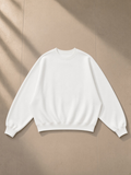 Essential Heavyweight Dolman Sleeve Boxy Sweatshirt in White, laid flat on pale limestone, front.