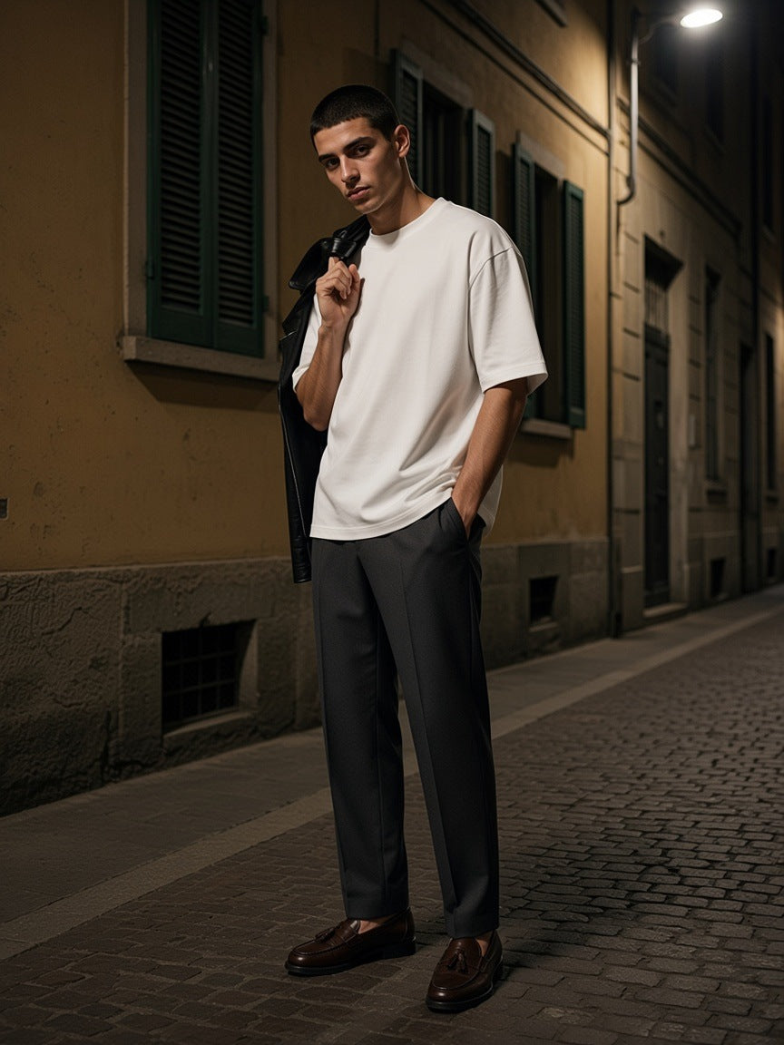 Man in the Oversized Cotton T-Shirt in White on a Brera side street in Milan at night