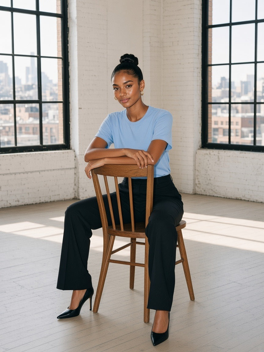 Woman in the Pure Cotton T-Shirt in Sky Blue in a Tribeca loft in New York in the morning