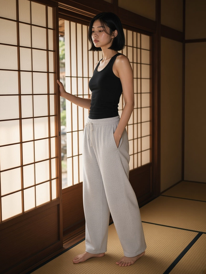 Woman in the Relaxed Drawstring Three-quarter Sweatpants in Flower Gray in a ryokan suite in Kyoto by day