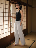 Woman in the Relaxed Drawstring Three-quarter Sweatpants in Flower Gray in a ryokan suite in Kyoto by day