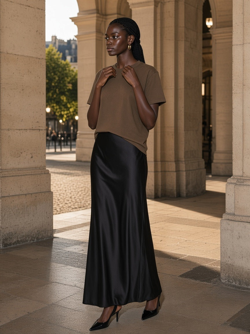 Woman in the Vintage Wash Distressed T-Shirt in Coffee, under a stone colonnade in the morning in Paris