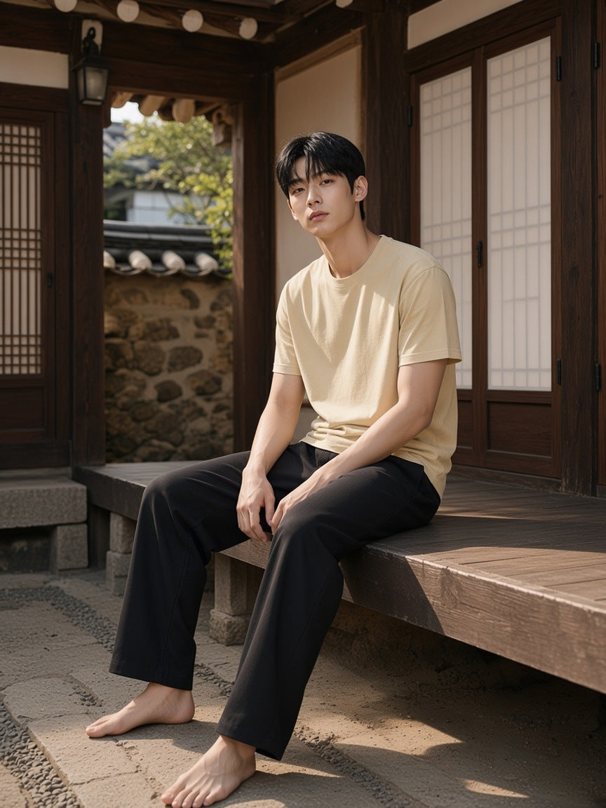 Man in the Vintage Wash Distressed T-Shirt in Khaki on a hanok veranda in Seoul in the morning