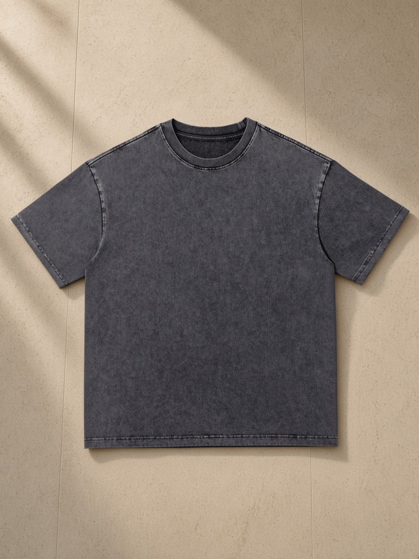 Snow Washed Heavyweight Oversize T-Shirt in Gray, laid flat on pale limestone