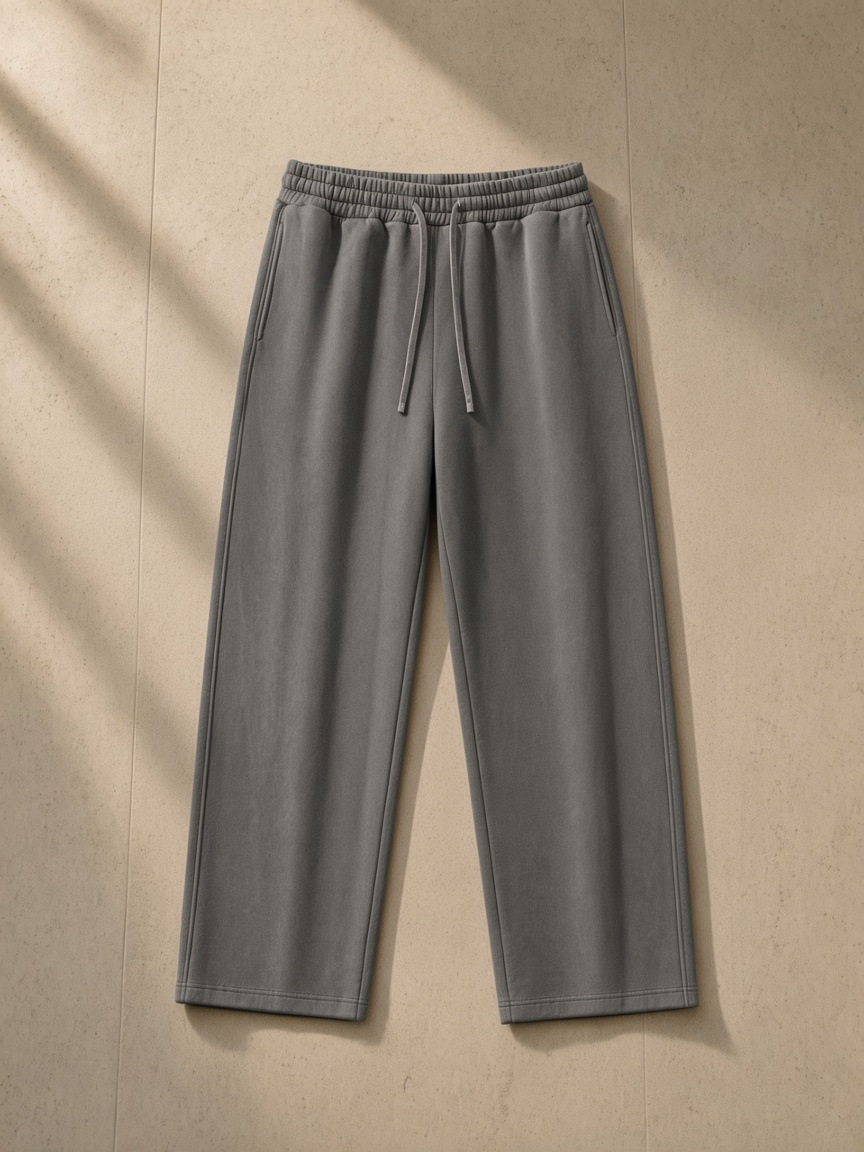 Vintage Washed Waist Pants in Dark Gray, laid flat on pale limestone