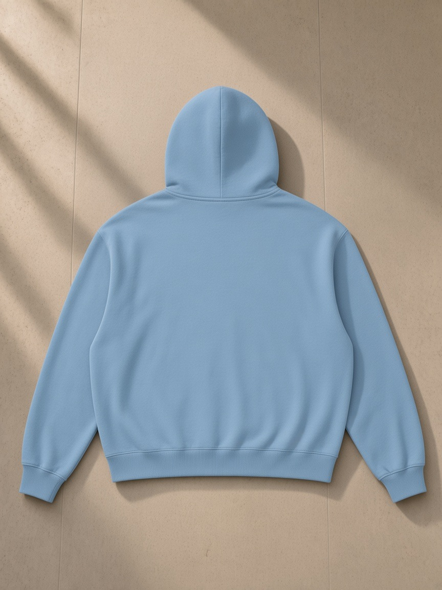 Vintage Wash Boxy Full Zip Hoodie in Haze Blue, laid flat on pale limestone, back view
