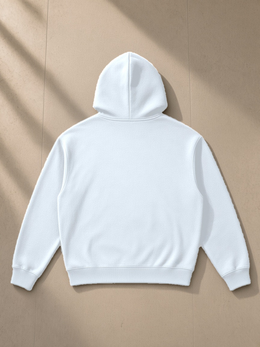Essential Boxy Heavyweight Drop-Shoulder Hoodie in Blue, laid flat on pale limestone, back view
