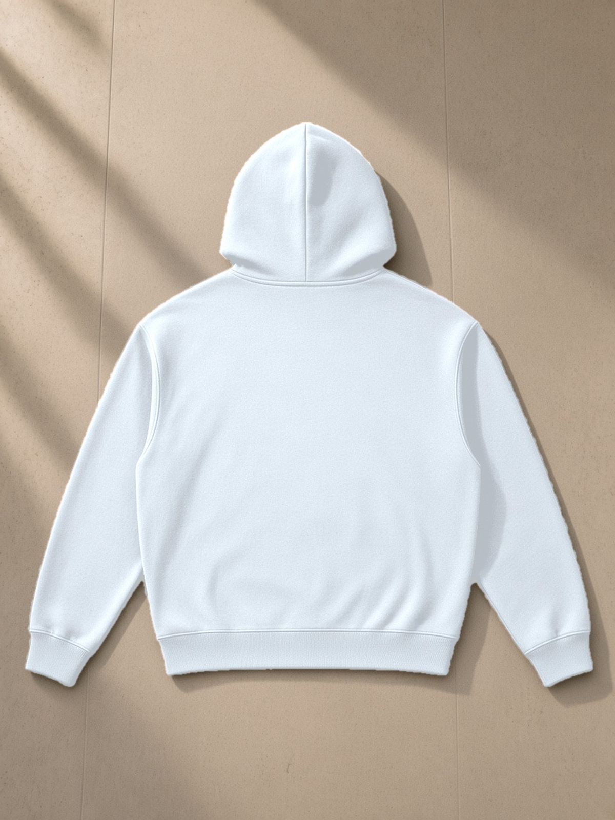 Essential Boxy Heavyweight Drop-Shoulder Hoodie in Blue, laid flat on pale limestone, back view