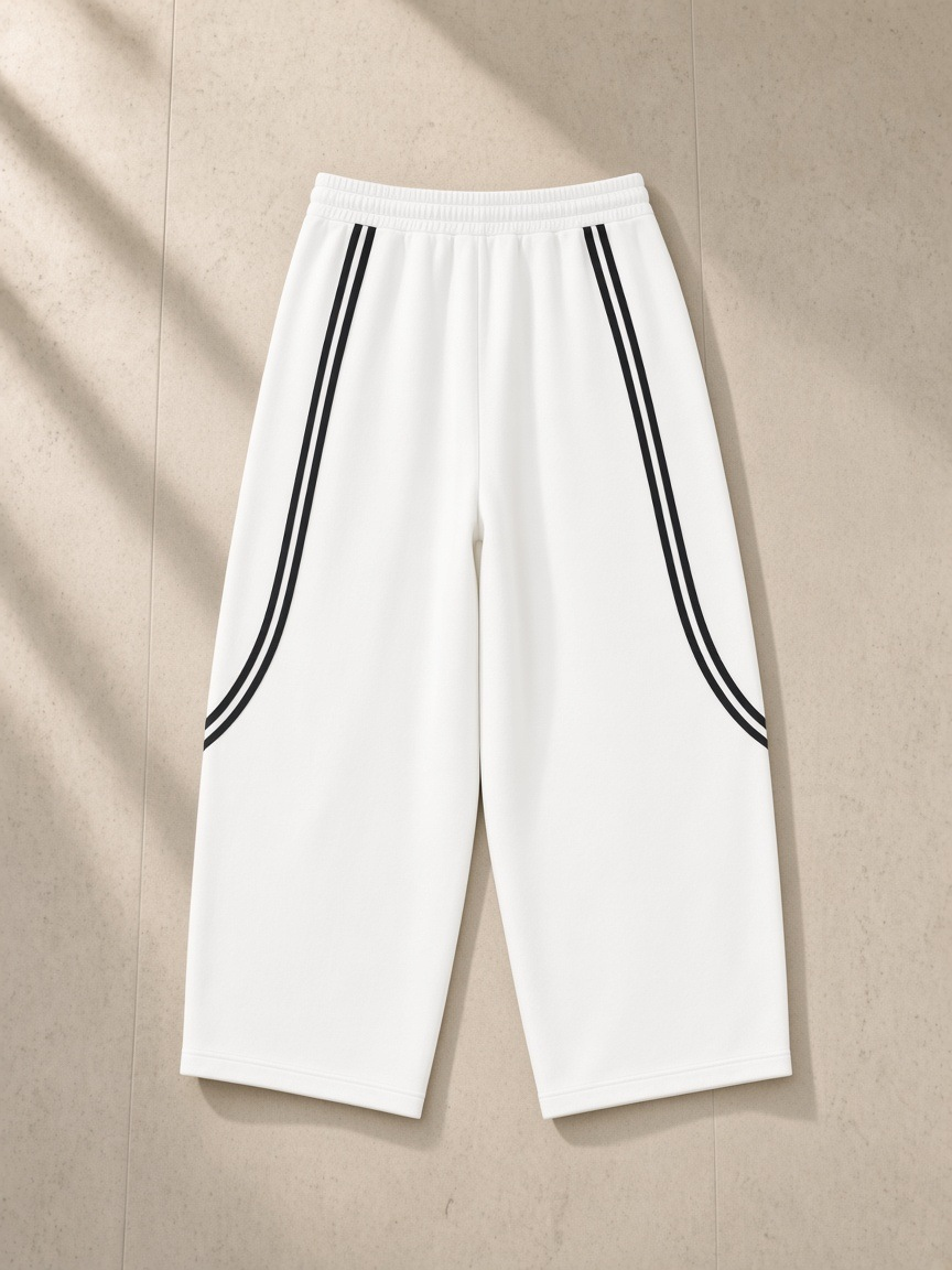 Wide Leg Piping Sweatpants in White, laid flat on pale limestone, back.
