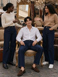 Three people in the Heavyweight Straight-Leg Denim Jeans in Navy Blue at a Paris flea market