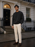 Two people à deux, the man wearing the Drop Shoulder Crewneck Sweatshirt in Washed Black