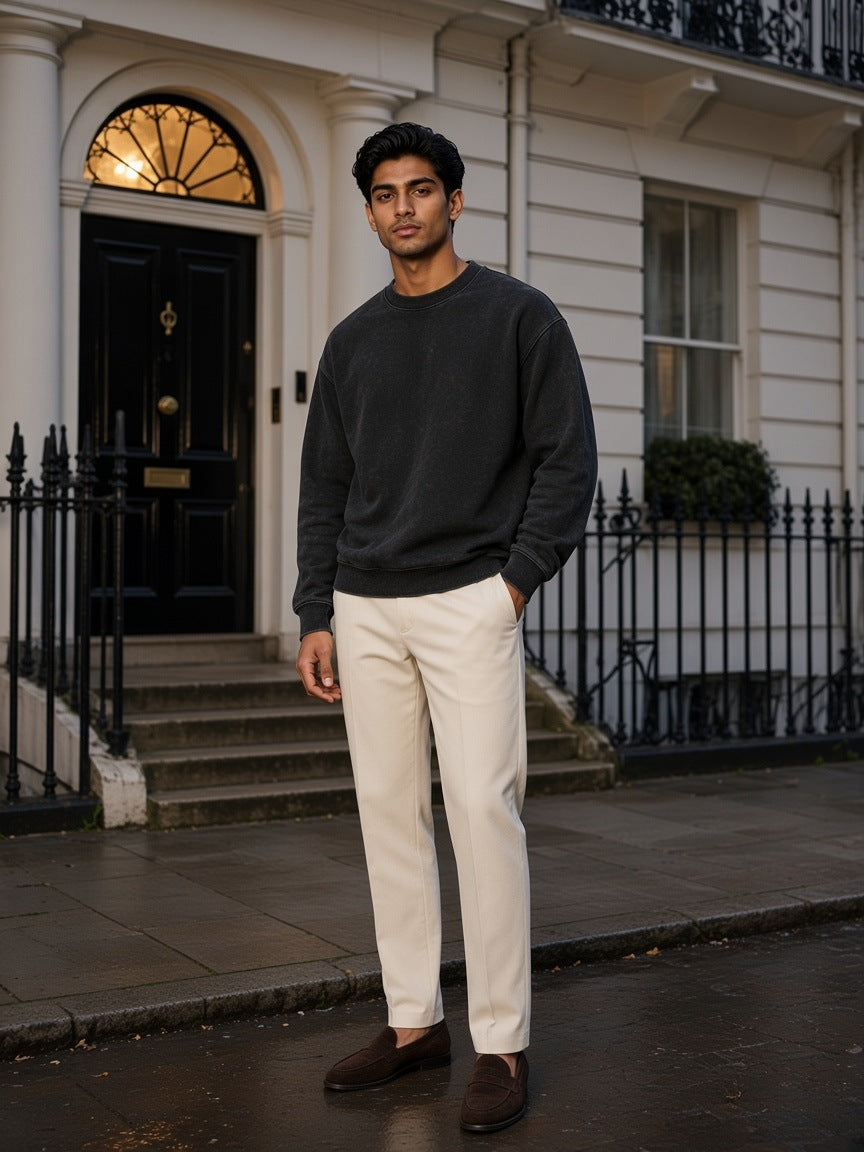 Two people à deux, the man wearing the Drop Shoulder Crewneck Sweatshirt in Washed Black